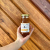 • Pure Raw Wild Honey 240ml glass bottle
• Hand holding raw wild honey bottle
• Natural unfiltered honey in glass jar
• Clean pantry staple raw honey